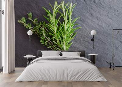 Thyme and Rosemary Bundles on Black Stone Surface Background Wall mural