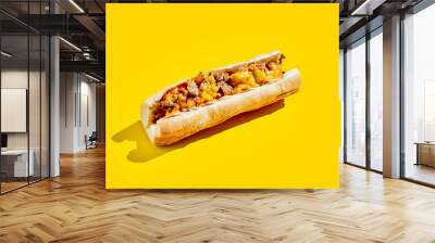 Chiken cheesesteak in minimal style. American fast food in yellow background with shadow. Philly steak sandwich trendy concept. Junk food in colour background. Wall mural