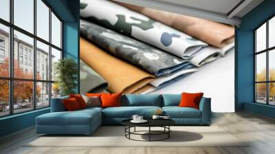 Diverse Camouflage Textures Modern Fashion Patterns Displayed on Colorful Fabric Pages Wall mural