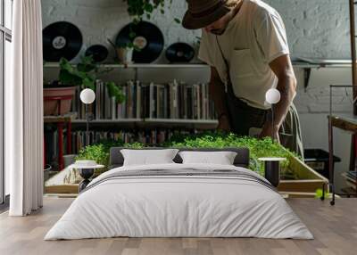 Male Musician in His 30s Tending Microgreens in Music Studio with Instruments and Records, Morning, Calm, Casual Attire Wall mural