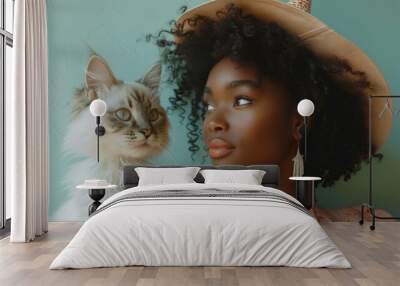 Young African-American Woman Engaging with Fluffy Cat in a Cozy Indoor Setting Wall mural