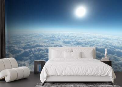 A tranquil skyscape above the clouds, with a vivid blue sky and a tiny bright sun just over the horizon Wall mural