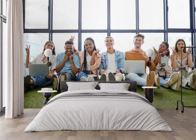 Friends, play and teamwork with a business team working on technology in their small business startup. Collaboration, design and creative with a man and woman employee group sitting on the floor Wall mural