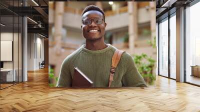 University student, black man and portrait at campus for education, learning and studying in Atlanta. Happy young male college student with motivation for knowledge, scholarship opportunity and goals Wall mural