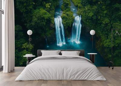 Aerial view of a beautiful waterfall, water flowing from a height into a stream. Wall mural