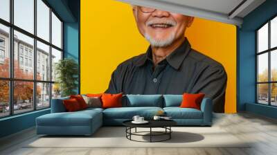 Asian elderly man on a yellow background. Wall mural