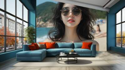 Asian woman traveling on the seaside, Female tourists dressed in casual clothes. Wall mural