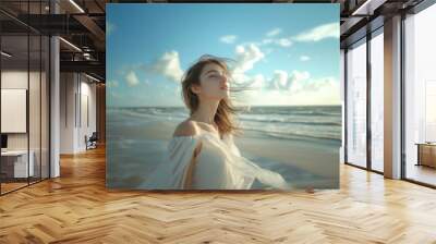 Caucasian woman in white dress walking on the beach. Wall mural