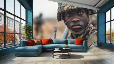 Closeup of African American male soldier in camouflage military uniform performing duties in the forest. Wall mural