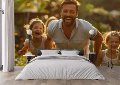 Happy family running in the park Laugh and have fun together on a holiday at home. Wall mural