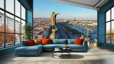 Christopher Columbus monument pointing towards America during the golden sunset in Barcelona, with the city background behind. Catalonia. aerial view Wall mural