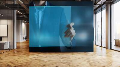 Close-up of a young man using futuristic latest innovative technology Wall mural