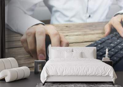 Contemporary looking guy working with computer Wall mural