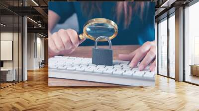 woman magnifying glass looking at keyboard with lock Wall mural