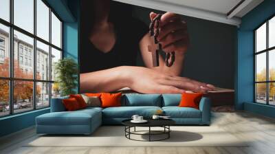 woman praying on book holding cross Wall mural