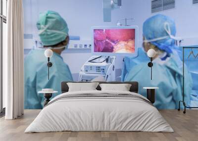 Surgeons performing surgery in operating Theater. Wall mural