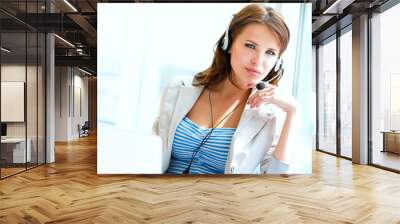 businesswoman talking on the phone while working on her computer Wall mural