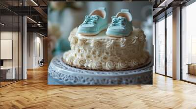 A baby shower cake with a fondant baby and tiny shoes, isolated on a white background. Wall mural