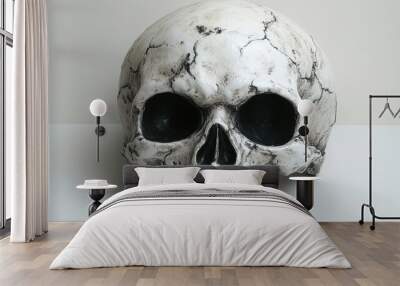 A spooky Halloween mask resembling a skull, with hollow eyes and sharp teeth, isolated on a white background Wall mural