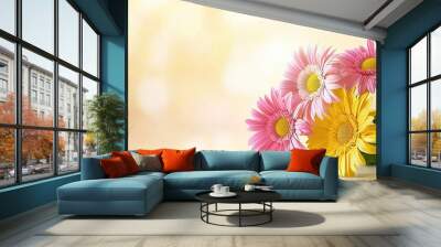 Bright pink and yellow gerbera daisies arranged together, their vibrant colors creating a fun and cheerful floral scene. Wall mural