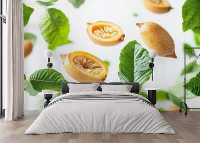 Tamarind with half slices falling or floating in the air with green leaves isolated on a white background. Wall mural