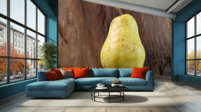 pear on a wooden table Wall mural