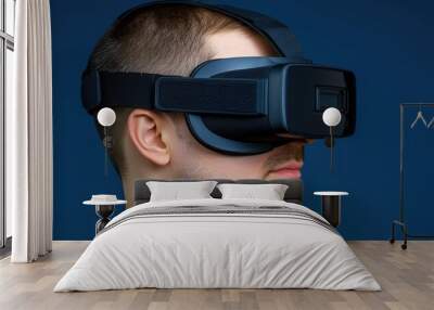 Virtual reality: the user immersed in the world of games with virtual reality glasses  Wall mural