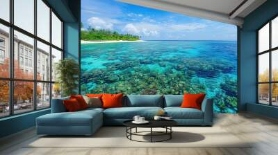 The pristine beaches of the Maldives, with turquoise waters gently lapping against white sandy shores. Coral reefs and colorful marine life are visible beneath the crystal-clear surface. Wall mural