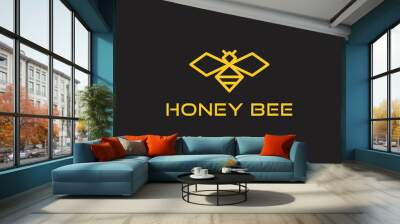 honey bee modern logo in gold color isolated on dark background Wall mural