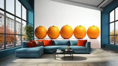 Oranges arranged in a row on a white background with copy space Wall mural