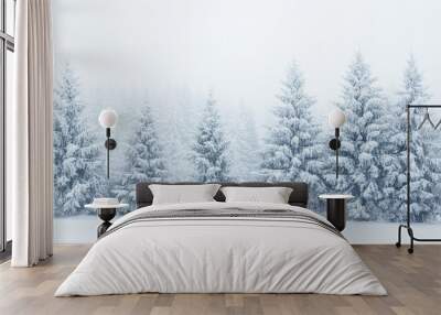 Winter white forest with snow-covered trees, ideal for creating a festive and serene Christmas background. Wall mural