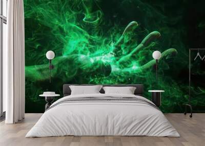 A translucent hand with green smoke swirling around it against a black background. Wall mural