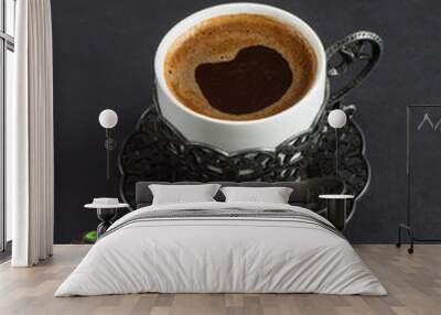 Cup of black Turkish coffee on a black background Wall mural