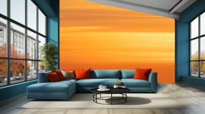 Panorama of the orange evening sky. Real majestic sunrise sundown sky background without birds. Wall mural