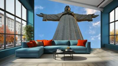 A statue of Cristo Rey and a view of the bridge named April 25 in Lisbon, Portugal. Wall mural