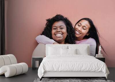 Beautiful latin women hugging each other and smiling - Girls with different body and skin color - Concept of friendship and happiness Wall mural