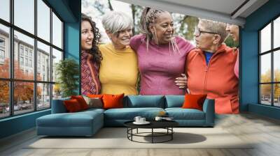 Cheerful multi generational women having fun at city park while hugging each other - Multiracial people meeting each other outdoor Wall mural