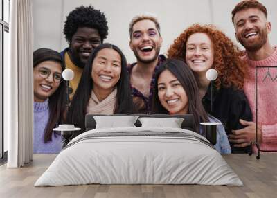 Group of multiethnic young people having fun outdoor while smiling on camera - Focus on the asian girl face Wall mural