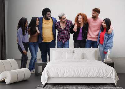 Group of multiracial young people hugging each other in the city - Concept of diversity Wall mural