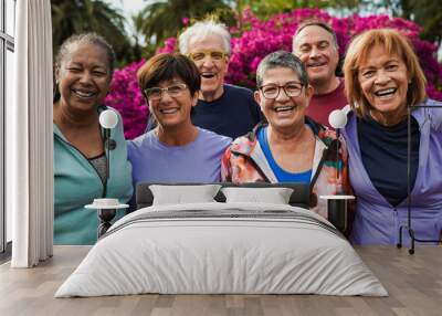 Group of senior friends smiling on camera after yoga lesson at city park Wall mural