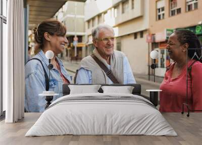 Happy multiracial senior friends meeting each other in the city - Joyful elderly people outdoor Wall mural