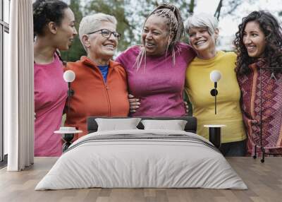 Multi generational women having fun together at park - Multiracial people meet and hugging each other outdoor Wall mural