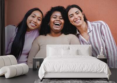 Young latin women smiling in front of camera - Multiracial girls having fun together in the city Wall mural