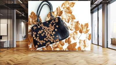  a designer handbag, isolated on a white background with subtle gold leaf patterns.  Wall mural