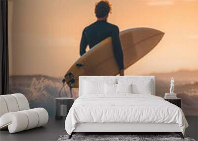 Man Walking Towards the Ocean with Surfboard at Sunset Wall mural