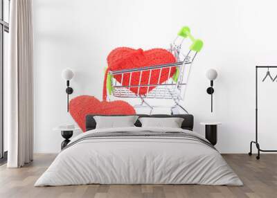 two knitted hearts in a shopping cart on a white background. creative valentines day concept Wall mural