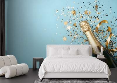 A bottle of champagne with glitter and golden confetti and copy space Wall mural