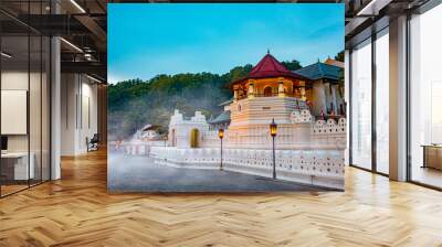 Temple of the tooth, a Buddhist temple also known as Sri Dalada Maligawa, covered with fog in Kandy, Sri Lanka. morning view, well famous destination among tourists.  Wall mural