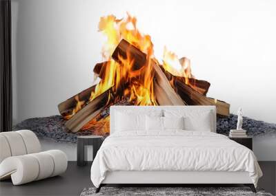 Campfire isolated on white background. Closeup of a pile of firewood burning with orange and yellow flames Wall mural