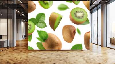 Flying juicy kiwi slices with leaves isolated on a white background Wall mural